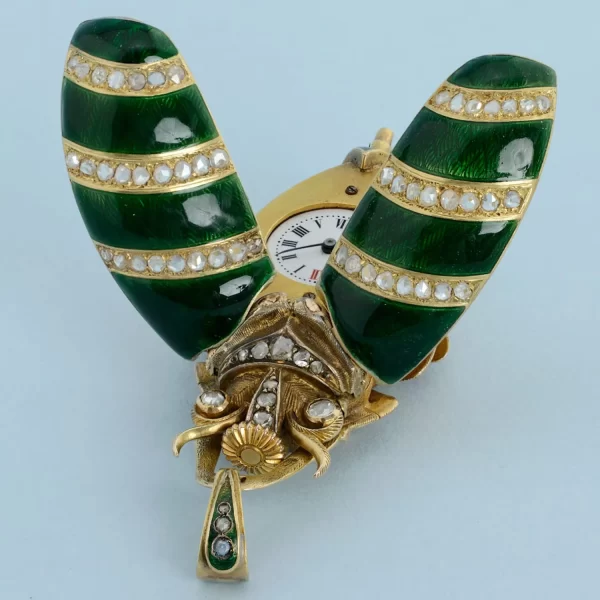GOLD AND ENAMEL BEETLE FORM WATCH 6 1