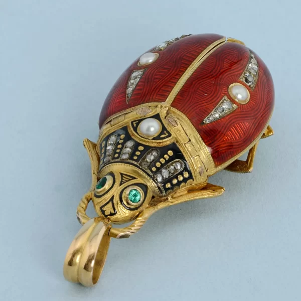 GOLD AND ENAMEL BEETLE FORM WATCH 6