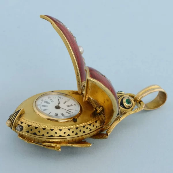 GOLD AND ENAMEL BEETLE FORM WATCH 7